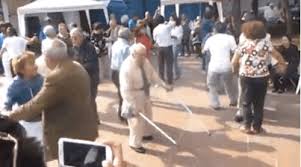 Old man rocking, throws down crutches- There goes his insurance claim
