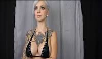 Watch tattooed model twerk her breasts to a Mozart symphony